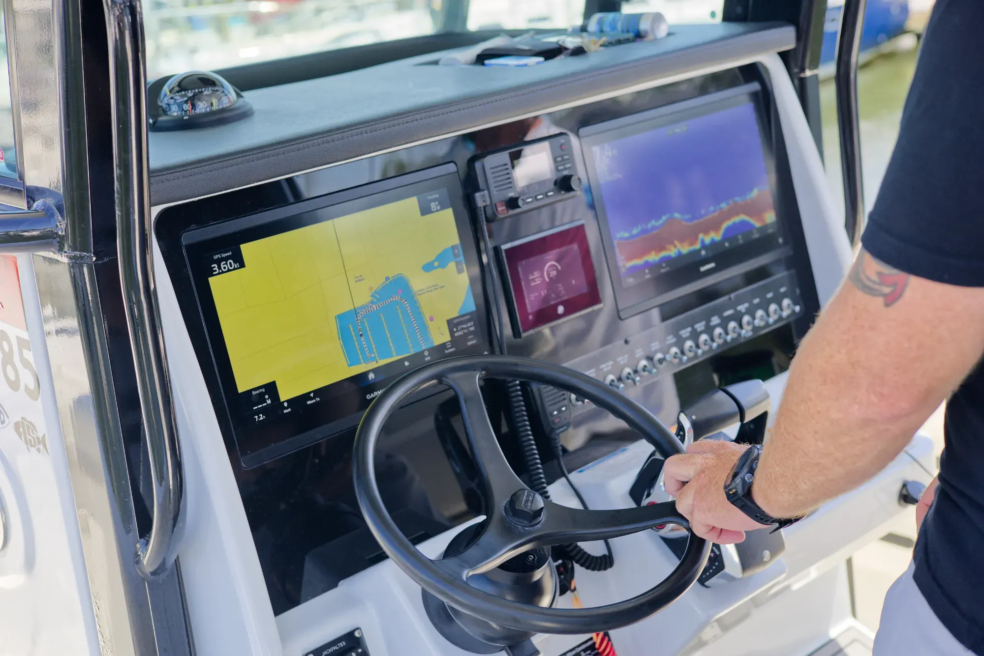 Modern navigation console and helm electronics aboard Phat Kat, 32 ft World Cat charter boat