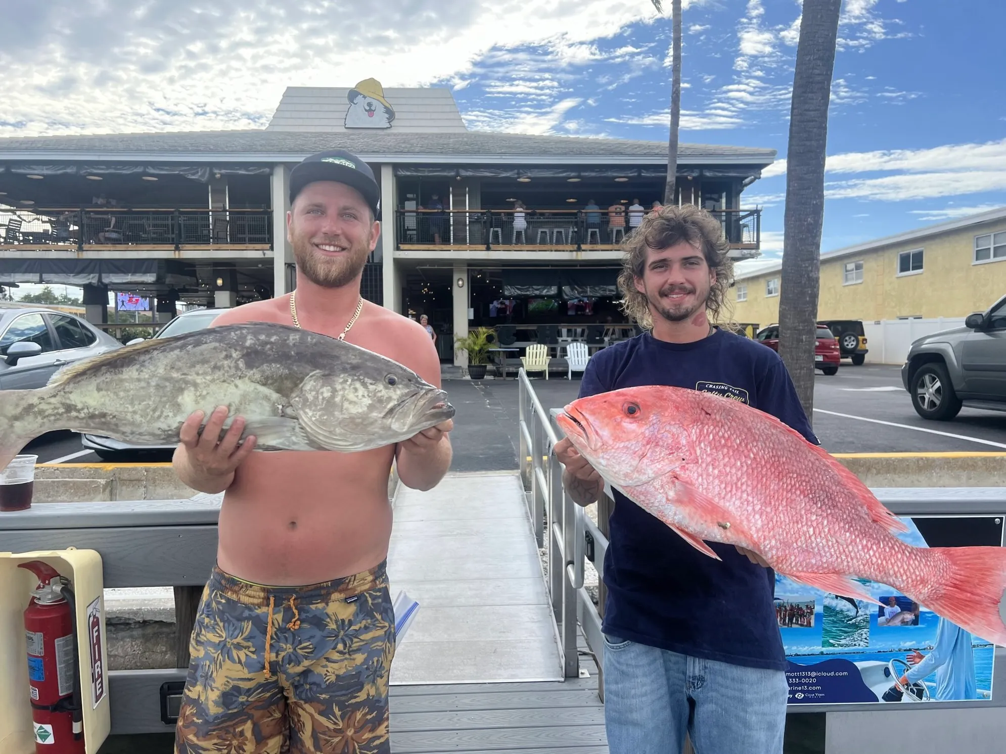 Charter group with a large mixed catch of grouper and snapper at the dock